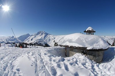 Snow covered hut on the mountain