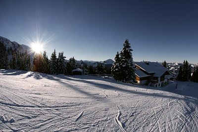 empty ski piste at sunset