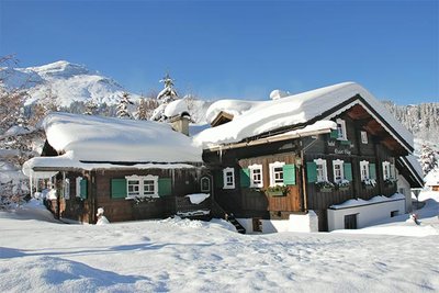 Chalet covered in snow