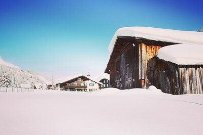 Barn in a snowy field