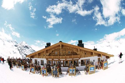 Traditional mountain hut on a snowy plateau