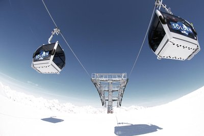 Ski lifts above a glacier