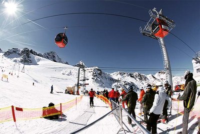 People standing on the snow of a glacier ski area