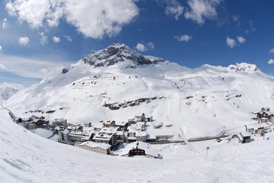 View from the mountain down to a snowy village